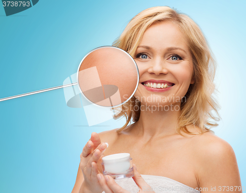 Image of happy woman with cream jar