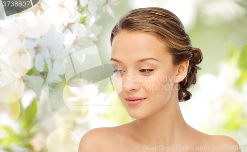 Image of smiling young woman face and shoulders