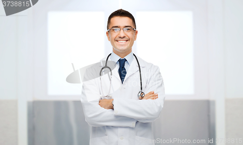 Image of smiling male doctor in white coat