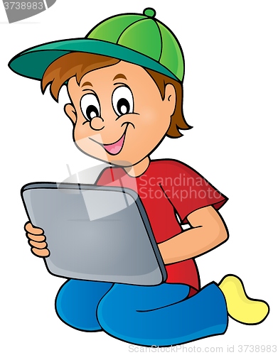 Image of Boy playing with tablet