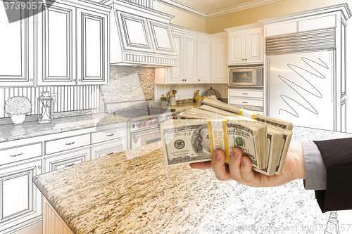 Image of Hand Handing Cash Over Kitchen Design Drawing and Photo Combinat