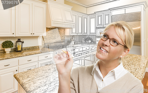 Image of Woman With Pencil Over Custom Kitchen Drawing and Photo Combinat