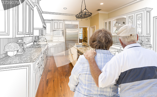 Image of Senior Couple Looking Over Custom Kitchen Design Drawing and Pho