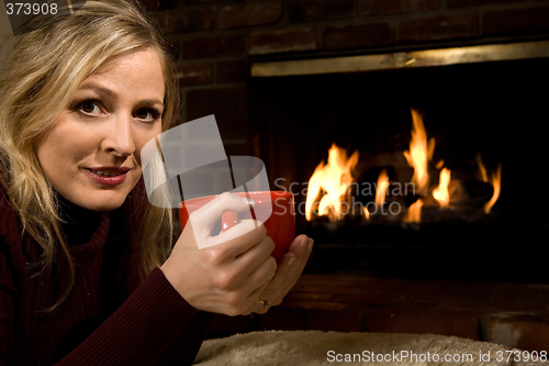 Image of Warming up by the fire