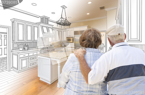 Image of Senior Couple Looking Over Custom Kitchen Design Drawing and Pho