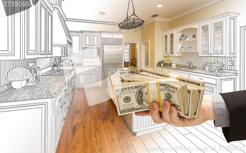 Image of Hand Handing Cash Over Kitchen Design Drawing and Photo Combinat