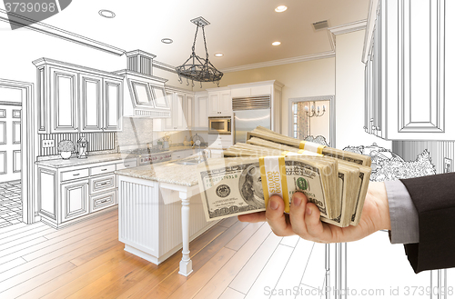 Image of Hand Handing Cash Over Kitchen Design Drawing and Photo Combinat