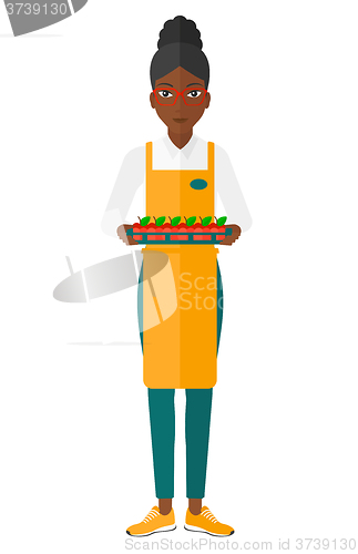 Image of Smiling supermarket worker.