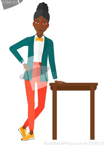 Image of Woman leaning on table.