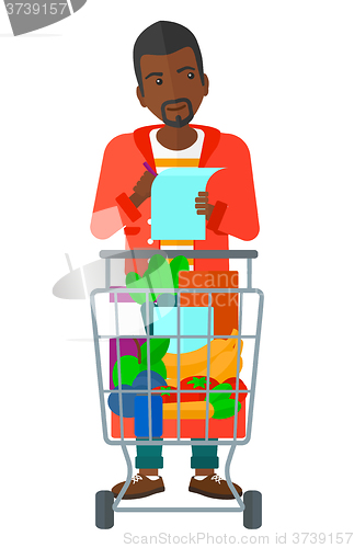 Image of Man with shopping list. 