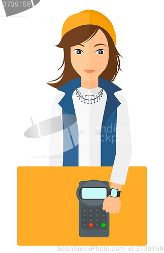 Image of Woman paying with smart watch.
