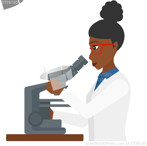 Image of Laboratory assistant with microscope.