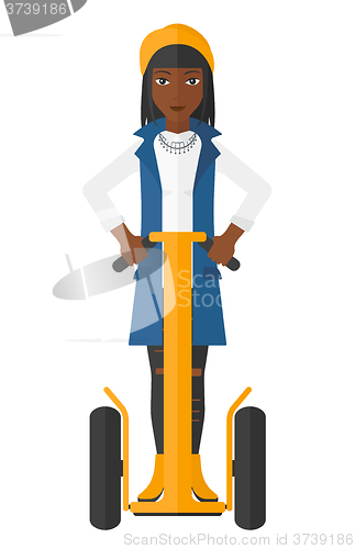 Image of Woman riding on segway.