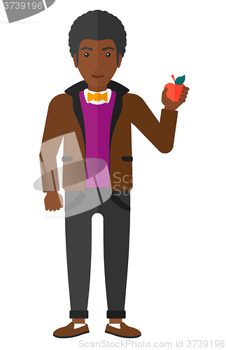 Image of Man holding apple.