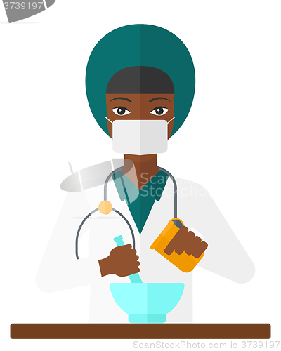 Image of Pharmacist preparing medicine.