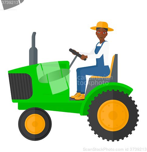 Image of Farmer driving tractor.