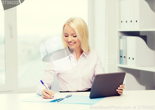 Image of smiling businesswoman or student with tablet pc