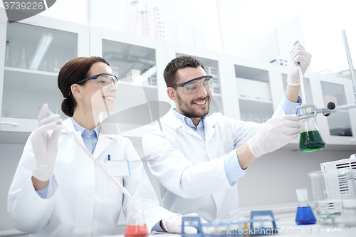 Image of young scientists making test or research in lab