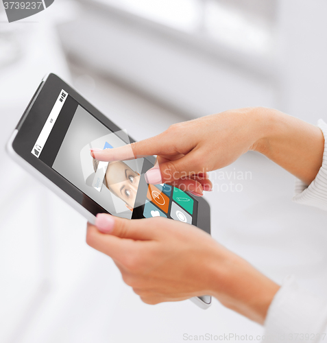 Image of close up of hands with web search on tablet pc