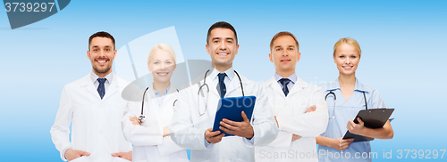 Image of group of doctors with tablet pc and clipboard