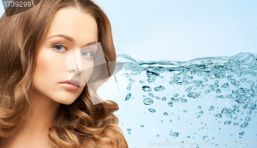 Image of young woman face with long shiny hair