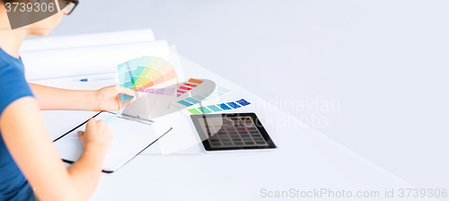 Image of woman working with color samples for selection