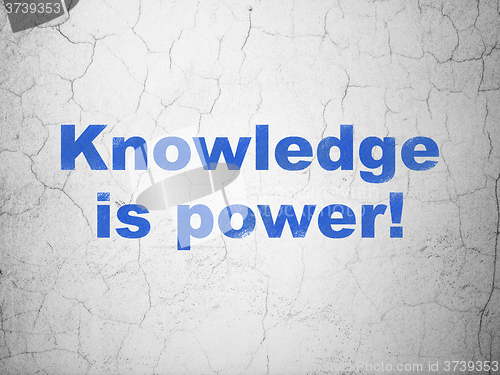 Image of Studying concept: Knowledge Is power! on wall background
