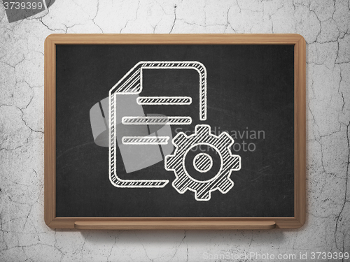 Image of Software concept: Gear on chalkboard background