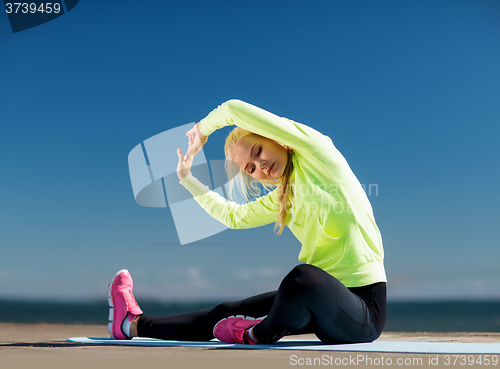 Image of woman doing sports outdoors