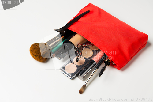 Image of close up of cosmetic bag with makeup stuff