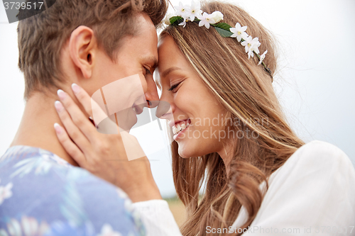 Image of happy smiling young hippie couple outdoors