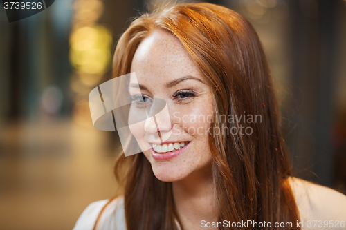 Image of smiling happy young redhead woman face