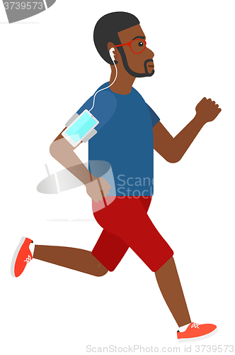 Image of Man jogging with earphones and smartphone.