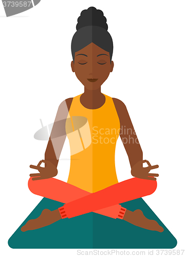 Image of Woman meditating in lotus pose.