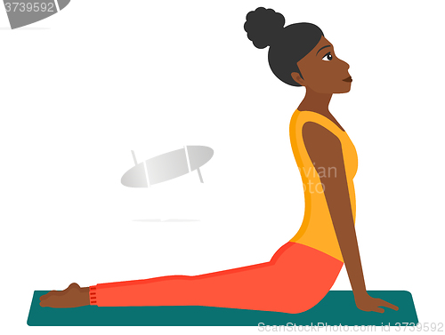 Image of Woman practicing yoga.