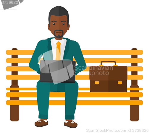 Image of Man working on laptop.