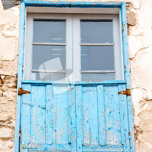 Image of blue window in morocco africa old construction and brown wall  c