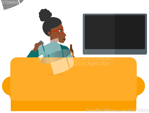 Image of Woman watching TV.