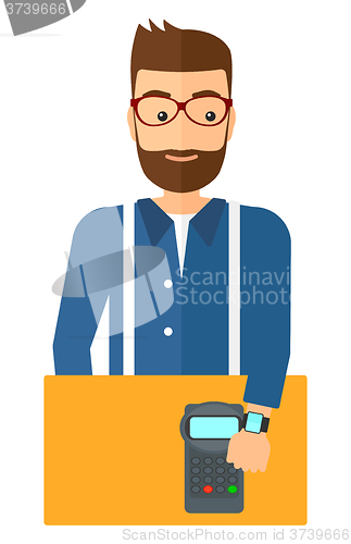 Image of Man paying with smart watch.