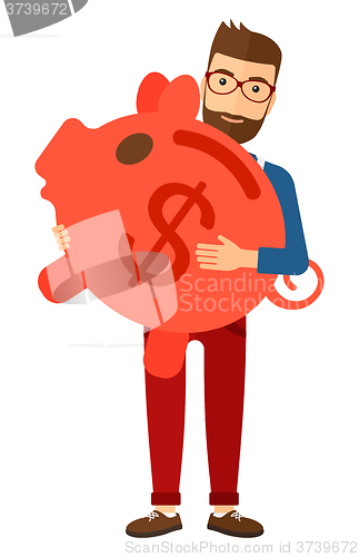 Image of Man carrying piggy bank.