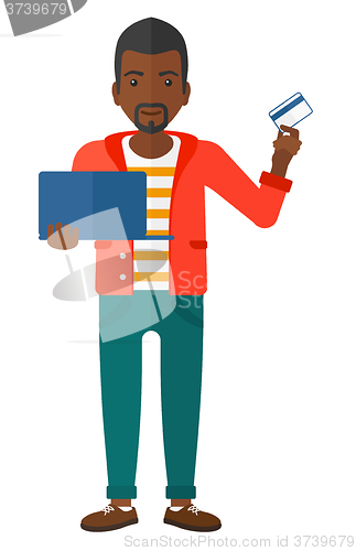 Image of Man making purchases online.