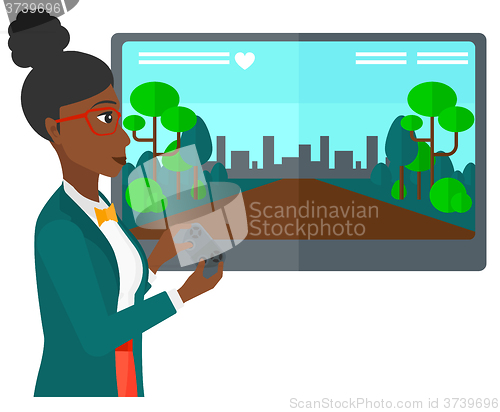 Image of Woman playing video game.