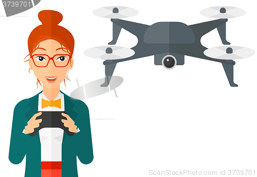 Image of Woman flying drone.