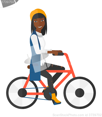 Image of Woman riding bicycle.