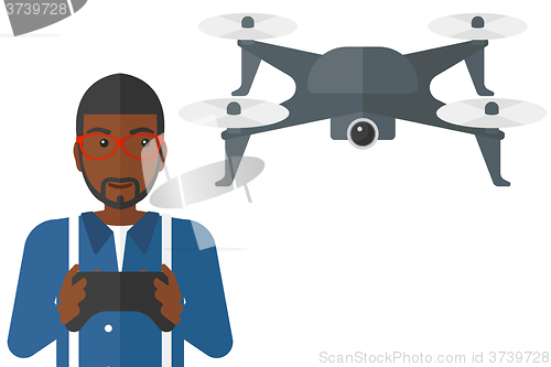 Image of Man flying drone.