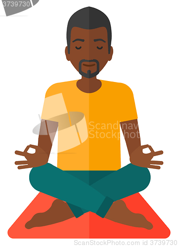 Image of Man meditating in lotus pose.