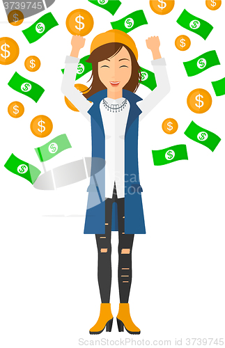 Image of Happy woman with  flying money. 