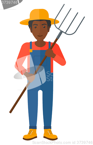 Image of Farmer with pitchfork.