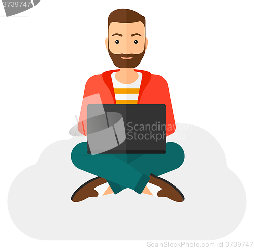 Image of Man sitting with laptop.