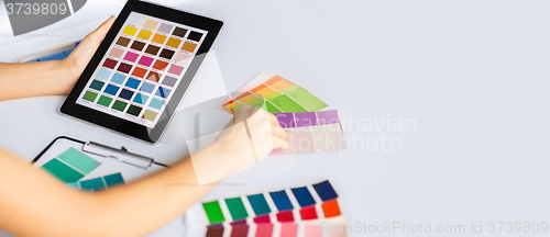 Image of woman working with color samples for selection